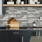 MORCART MT1189 grey stone-look wall tiles behind a kitchen sink, factory scene