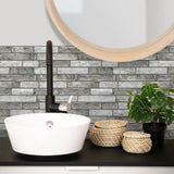 MORCART MT1189 grey stone-look wall tiles behind a vessel sink, factory scene