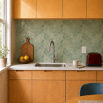 MORCART MT2217-XPE sage green herringbone peel-and-stick backsplash in a butter-yellow and maple kitchen, front wide view.