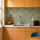 MORCART MT2217-XPE sage green herringbone peel-and-stick backsplash in a butter-yellow and maple kitchen, front wide view.