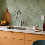 MORCART MT2217-XPE sage green herringbone backsplash, oblique detail showing original printed texture, glossy finish and sheet joints.