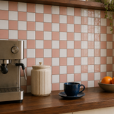 MORCART MT2419 grapefruit pink and white checkerboard backsplash, oblique detail with an espresso machine, cream canister and blue cup.
