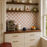 MORCART MT2419 grapefruit pink and white checkerboard backsplash in a coffee nook with cream cabinets and a walnut countertop, oblique wide view.